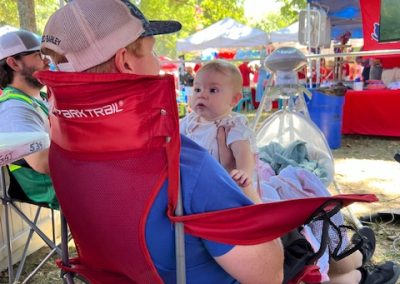 A young Ole Miss fan enjoying our tailgate setup in the Grove.