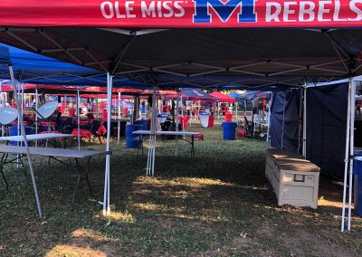 Branded tents reflect Rebel spirit in the Grove.
